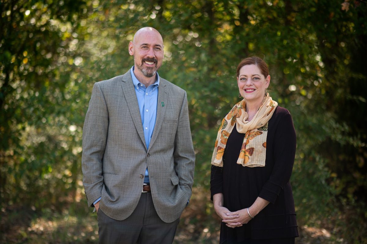 John Daniels stands next to Deb Thomas